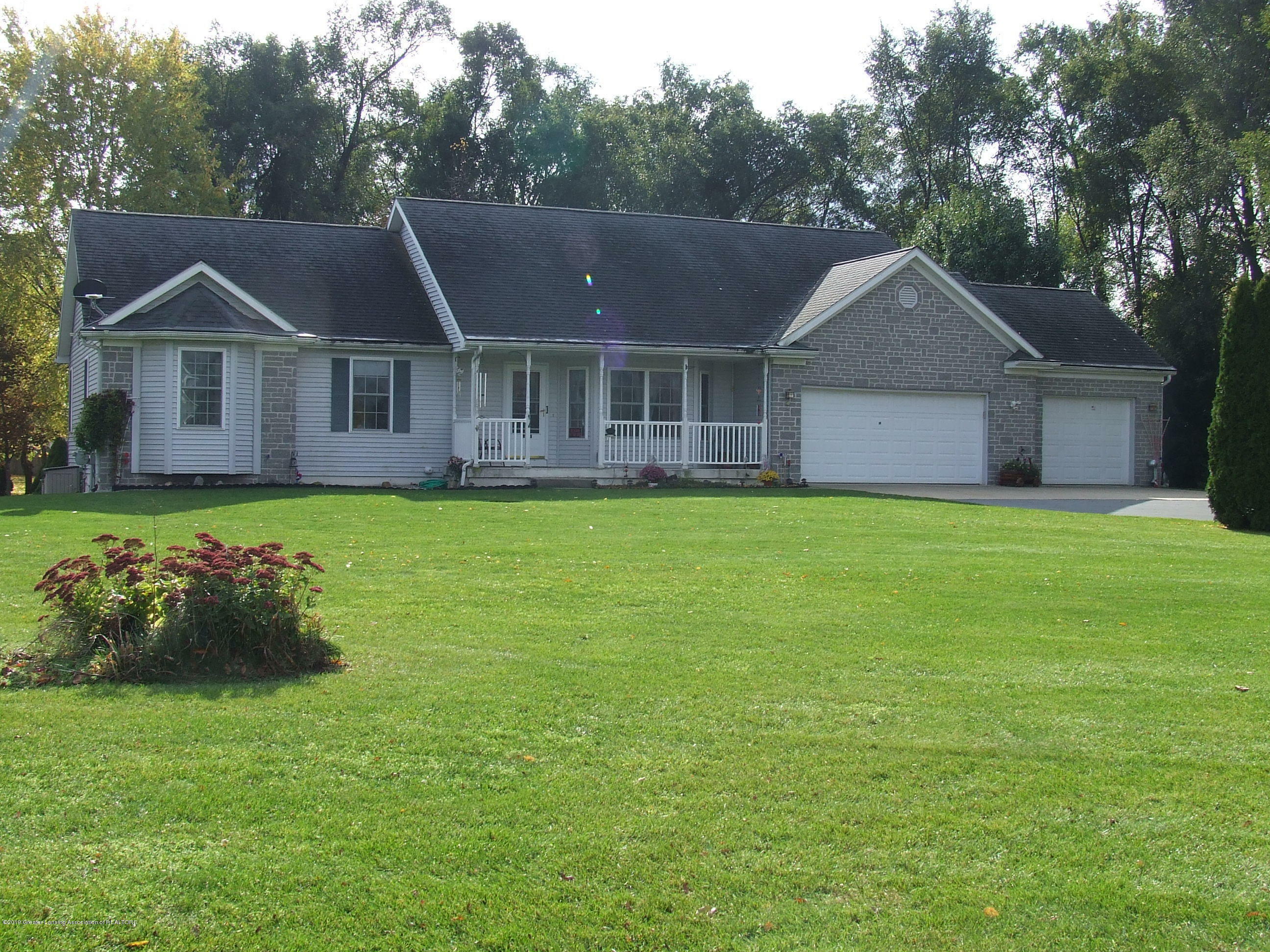 Property Photo:  1112 Nicholas Lane  MI 48813 