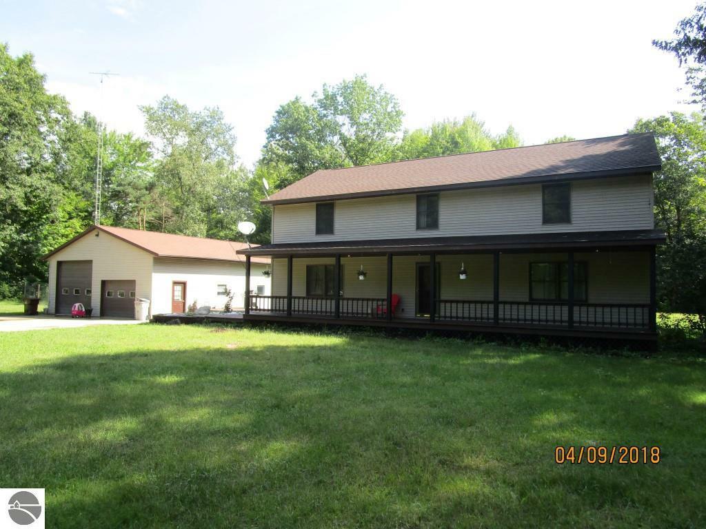 Property Photo:  11438 N Genuine Road  MI 48617 