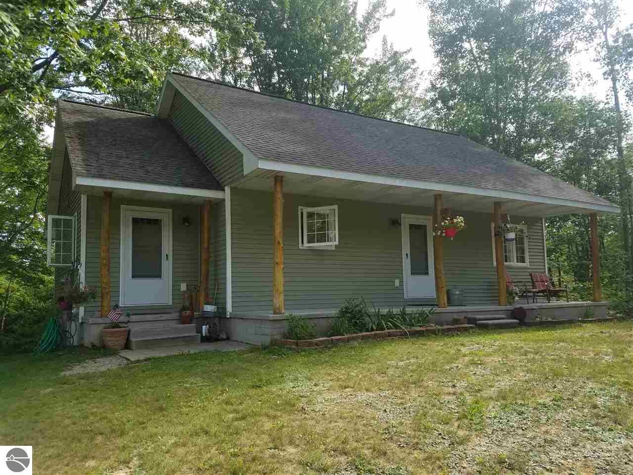 Property Photo:  113 Maple  MI 49601 