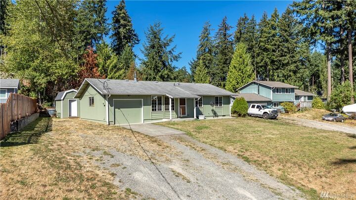 Property Photo:  7011 Locust Ave E  WA 98391 
