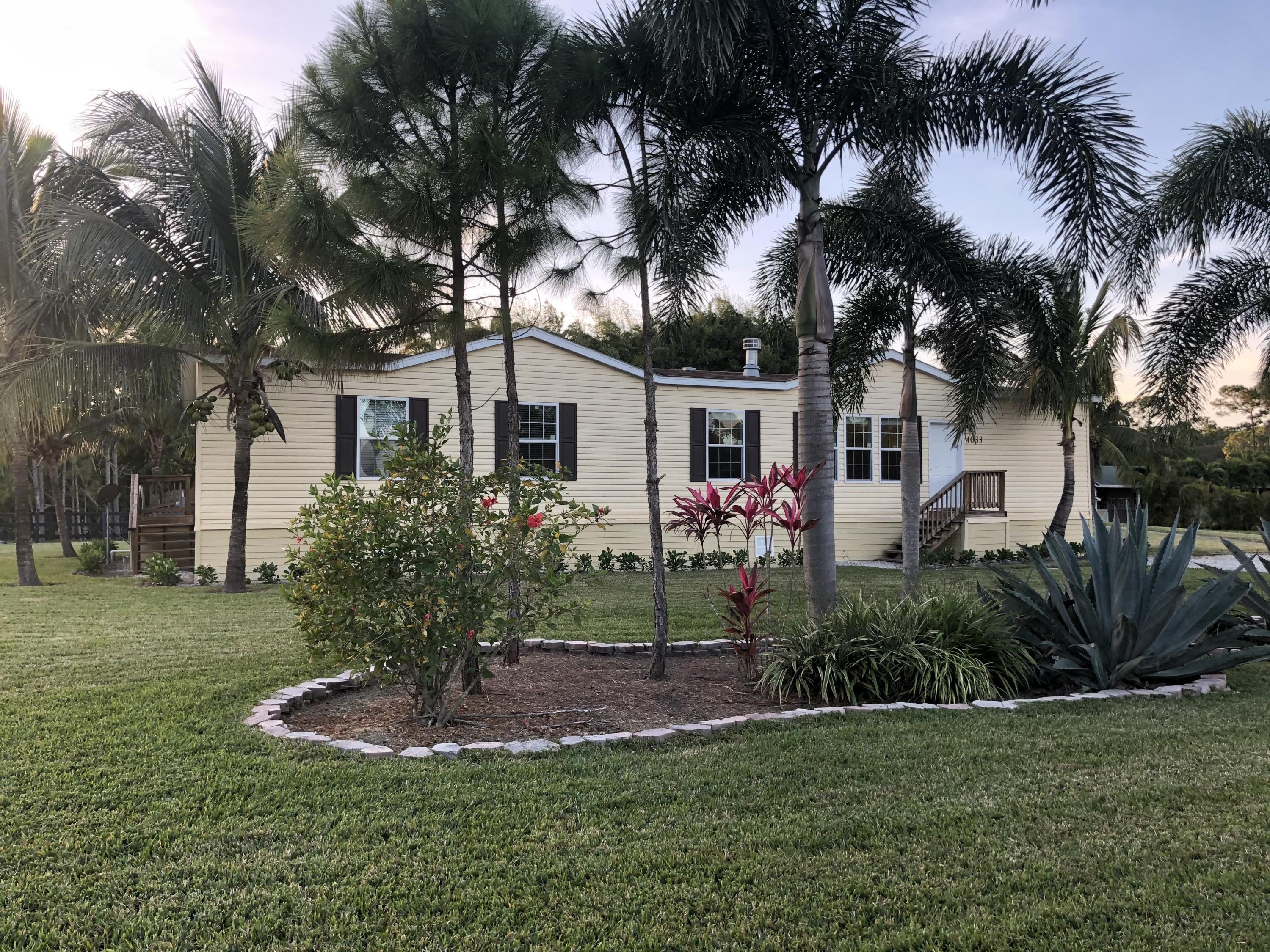 Property Photo: 4033 N 180th Avenue N FL 33470