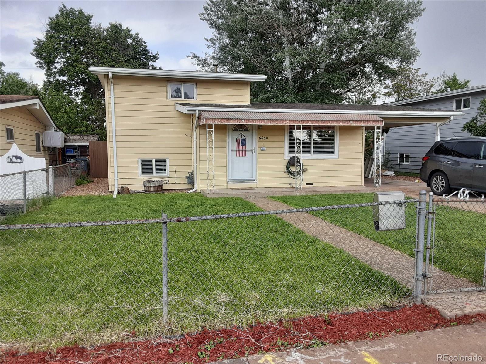 Property Photo:  6660 Albion Street  CO 80022 