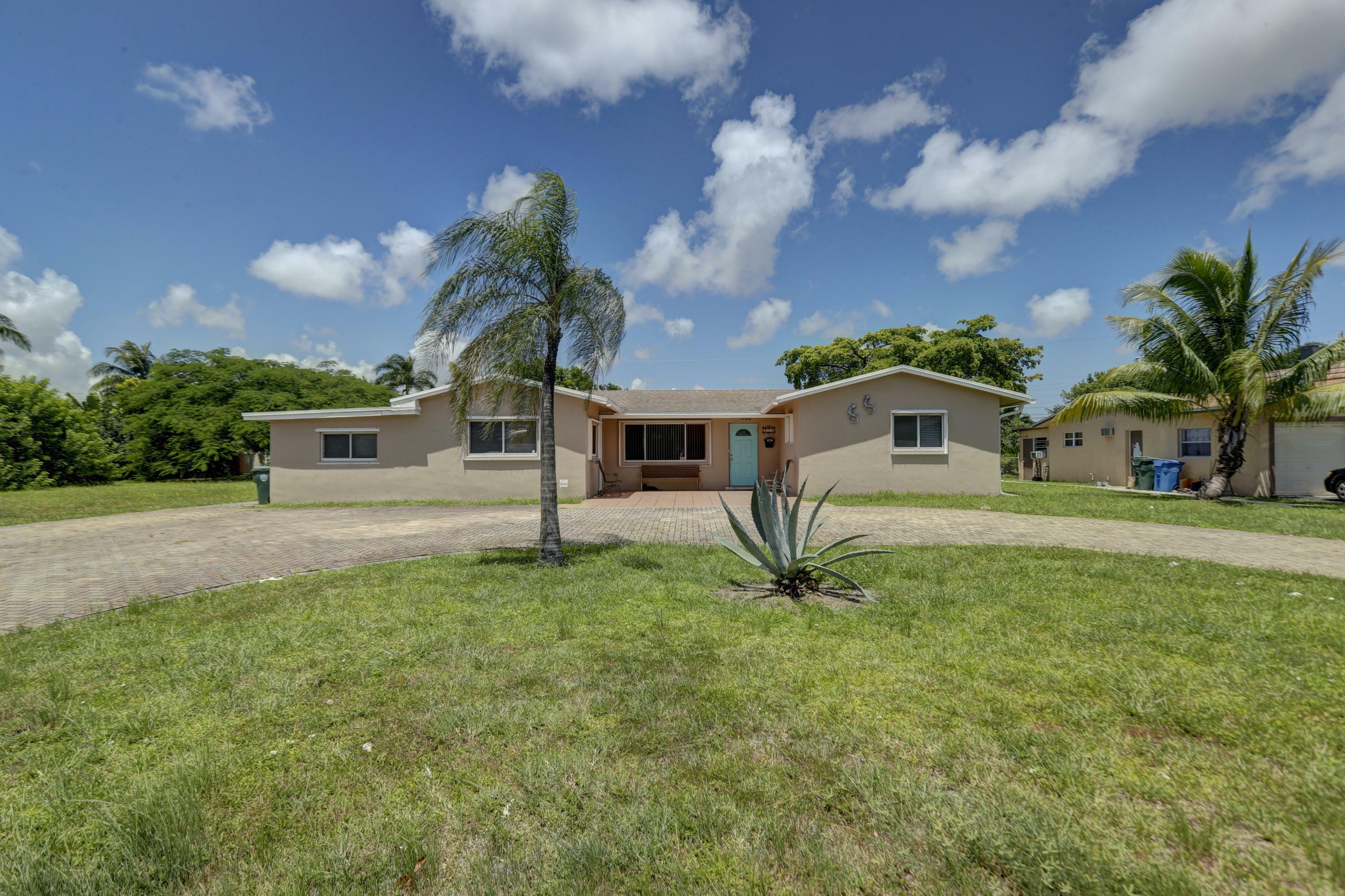 Property Photo:  121 NW 36th Street  FL 33309 