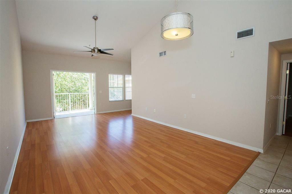 Property Photo:  9158 SW 51st Road J-302  FL 32608 