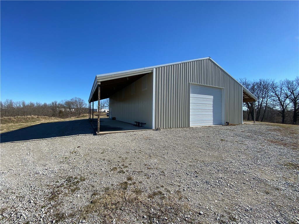 Property Photo:  704  71 W Outer Road  MO 64831 