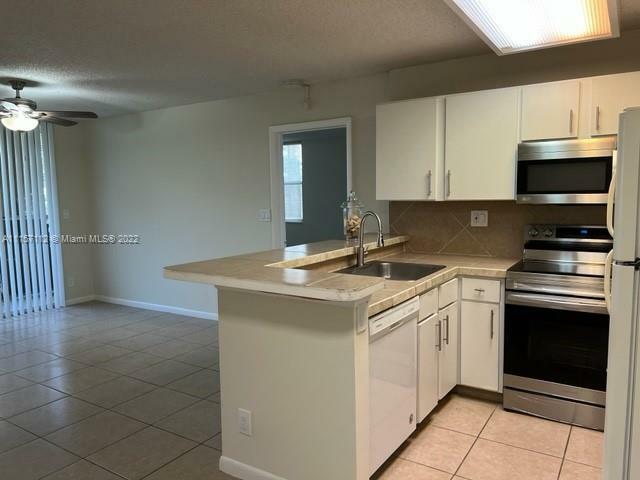 Property Photo:  941 Lyons Rd 5108  FL 33063 