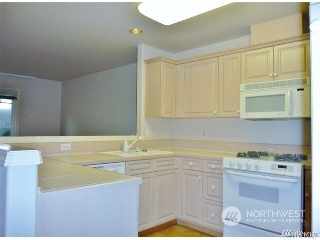 Property Photo:  8125 212th Street SW 12  WA 98026 