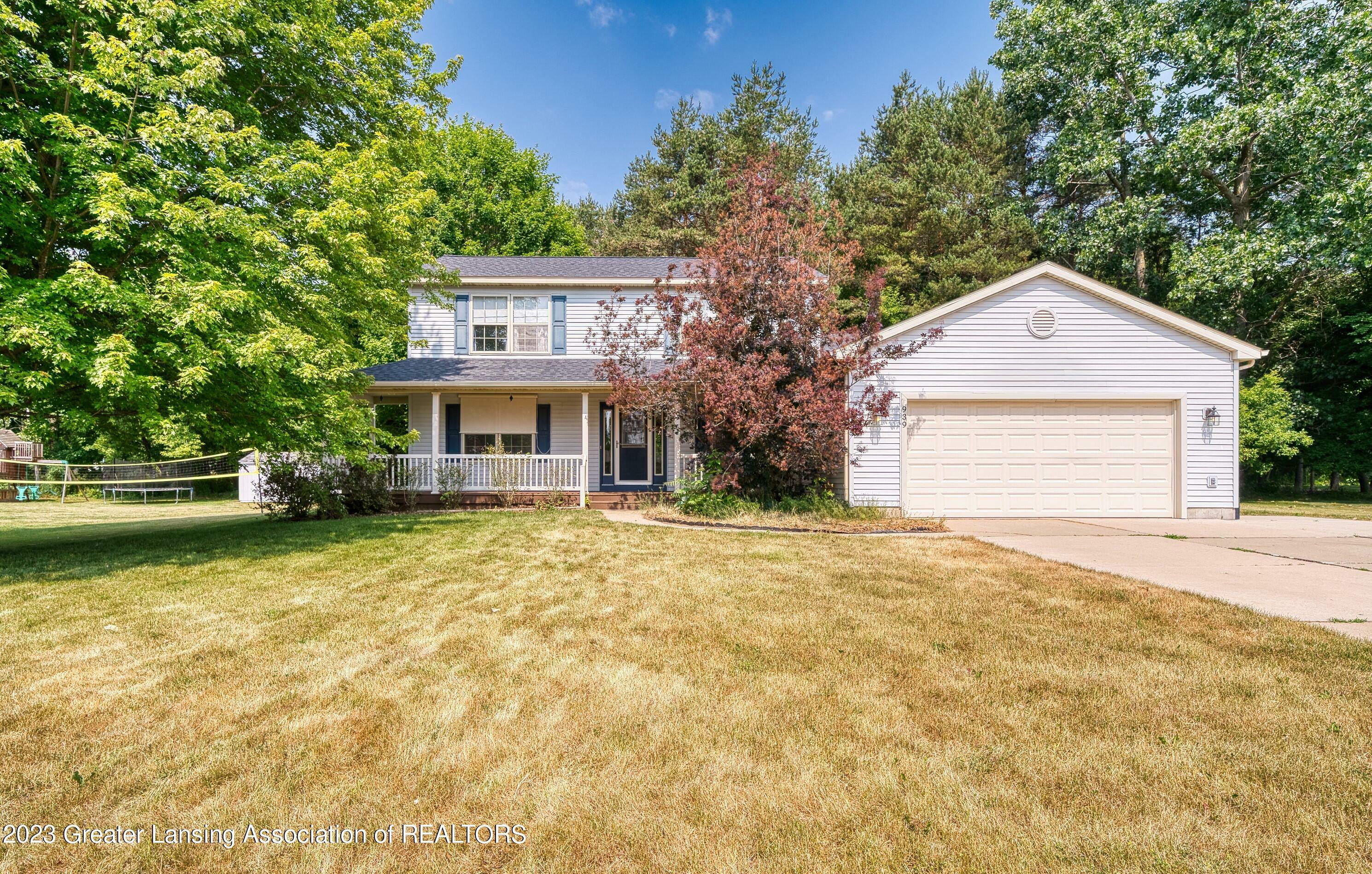 Property Photo:  939 Deerwood Lane  MI 48848 