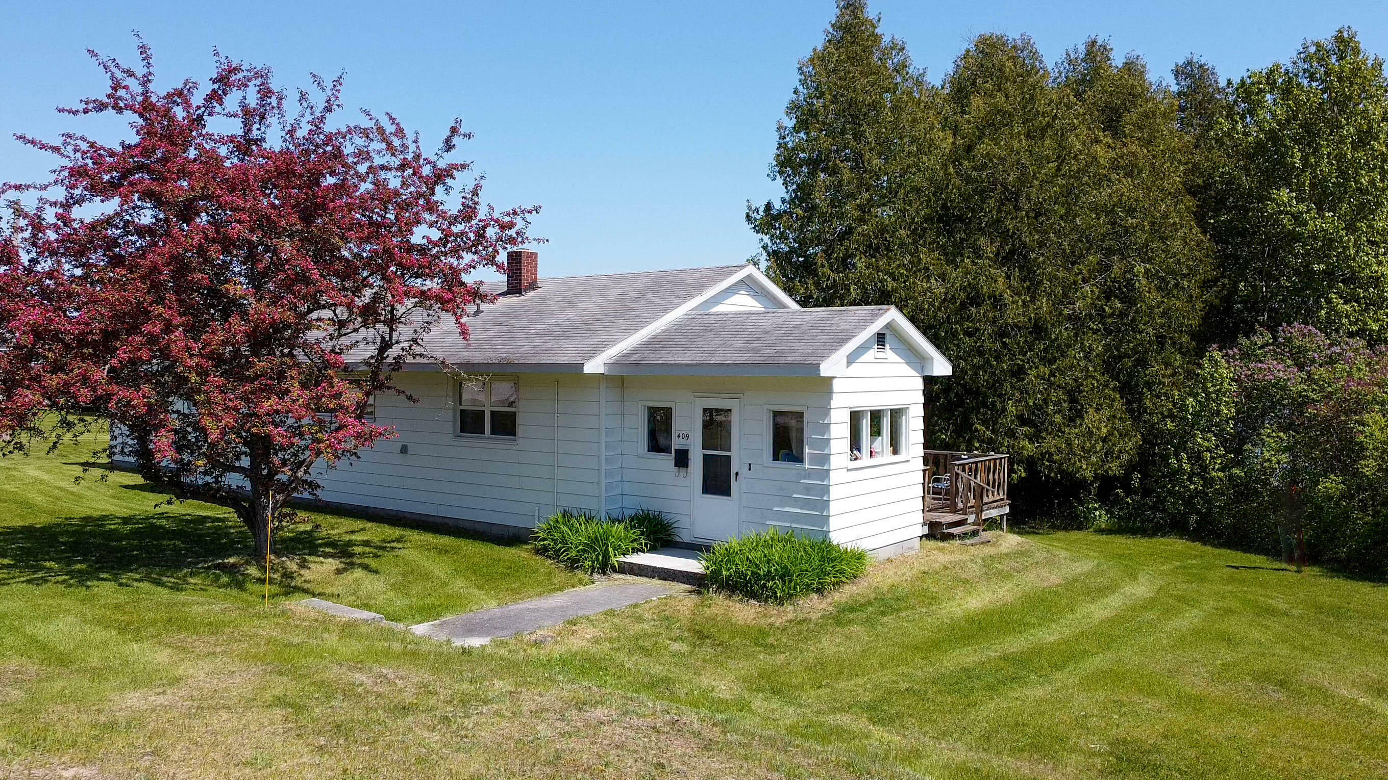 Property Photo:  409 S Superior St  MI 49725 