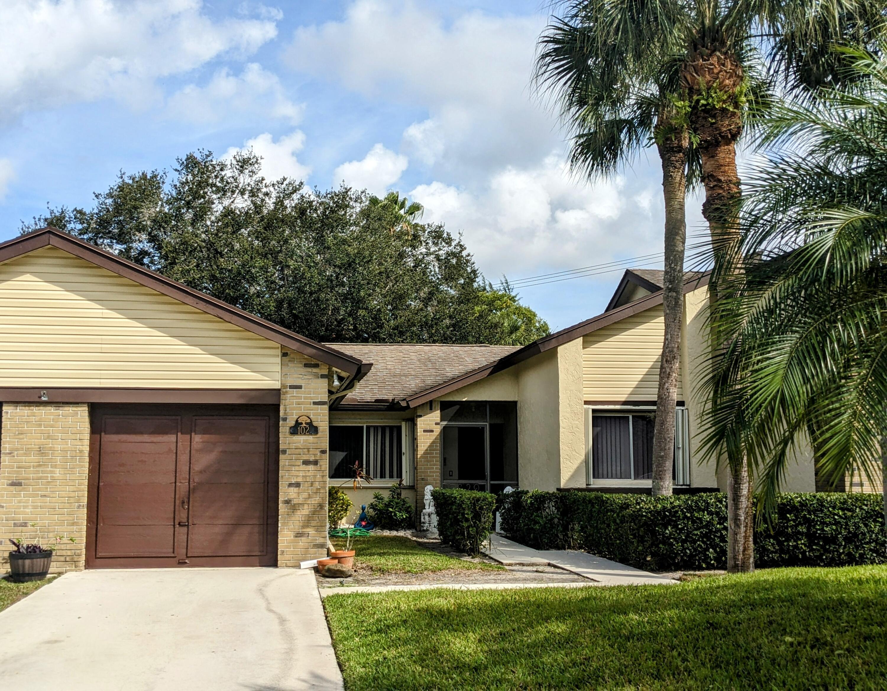 Property Photo: 102 Village Walk Drive FL 33411