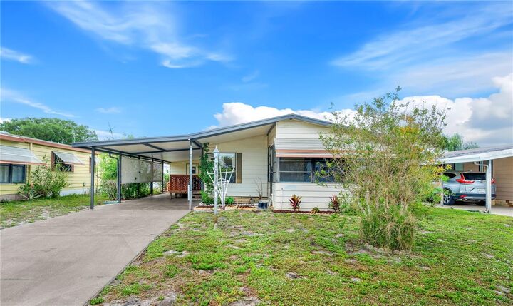 Property Photo: 6019 Grand Oaks Drive SE FL 33884