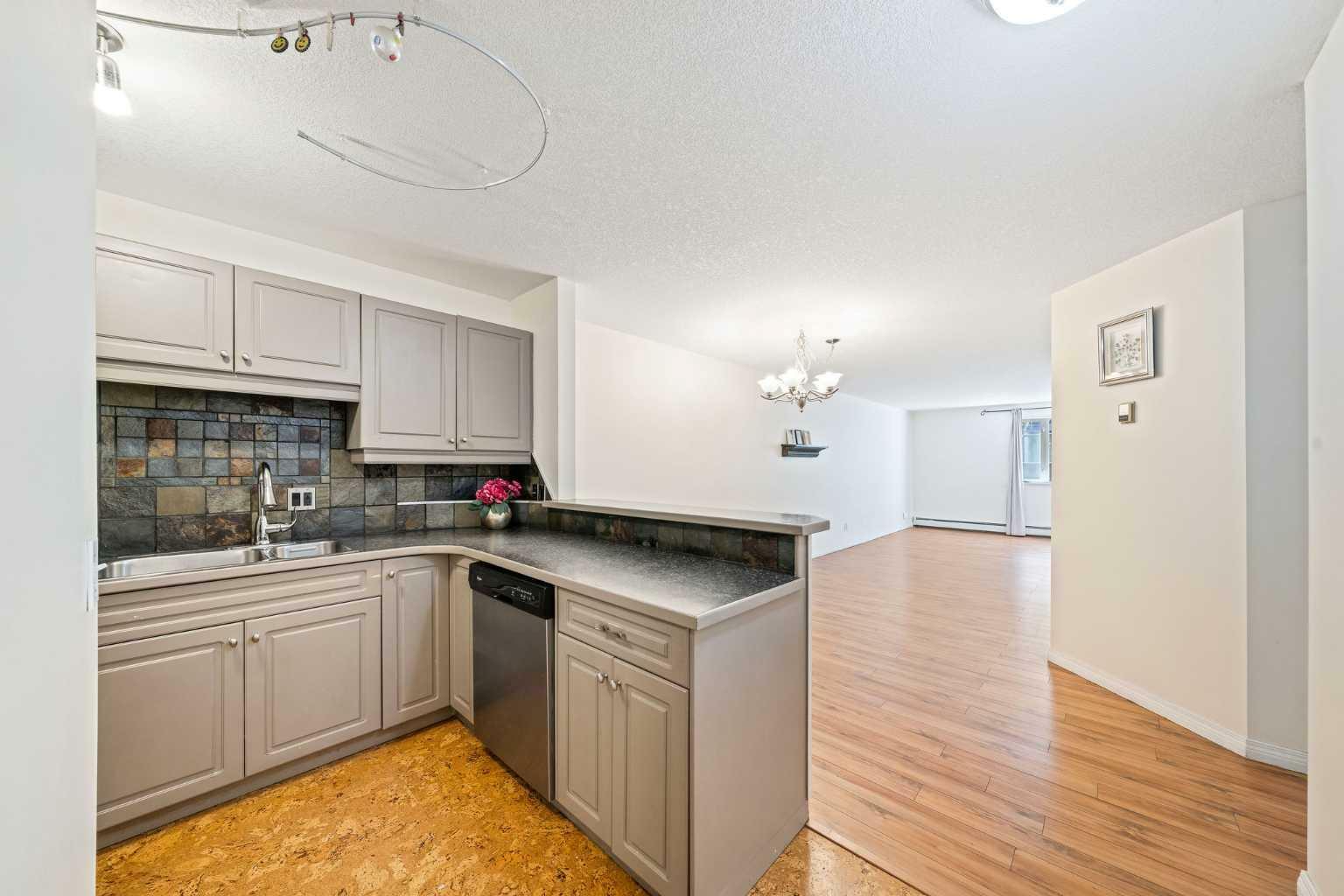 Property Photo:  705 56 Avenue SW 102  AB T2V 0G9 