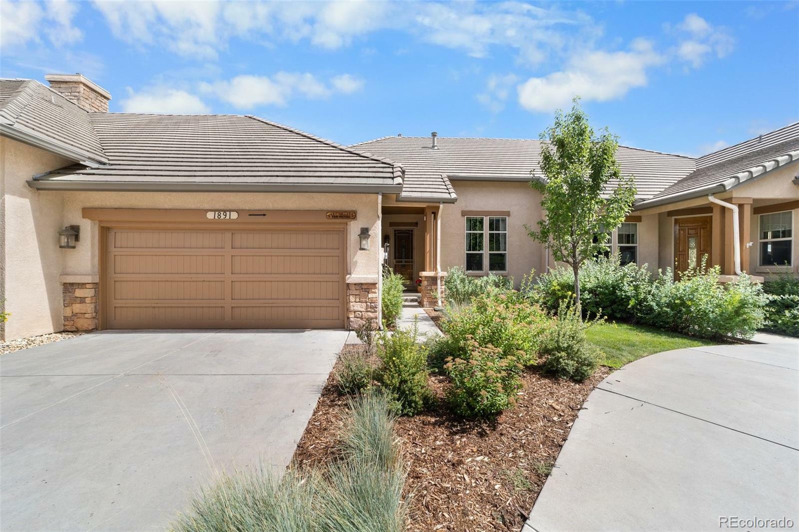 Property Photo:  1891 Pine Mesa Grove B  CO 80918 