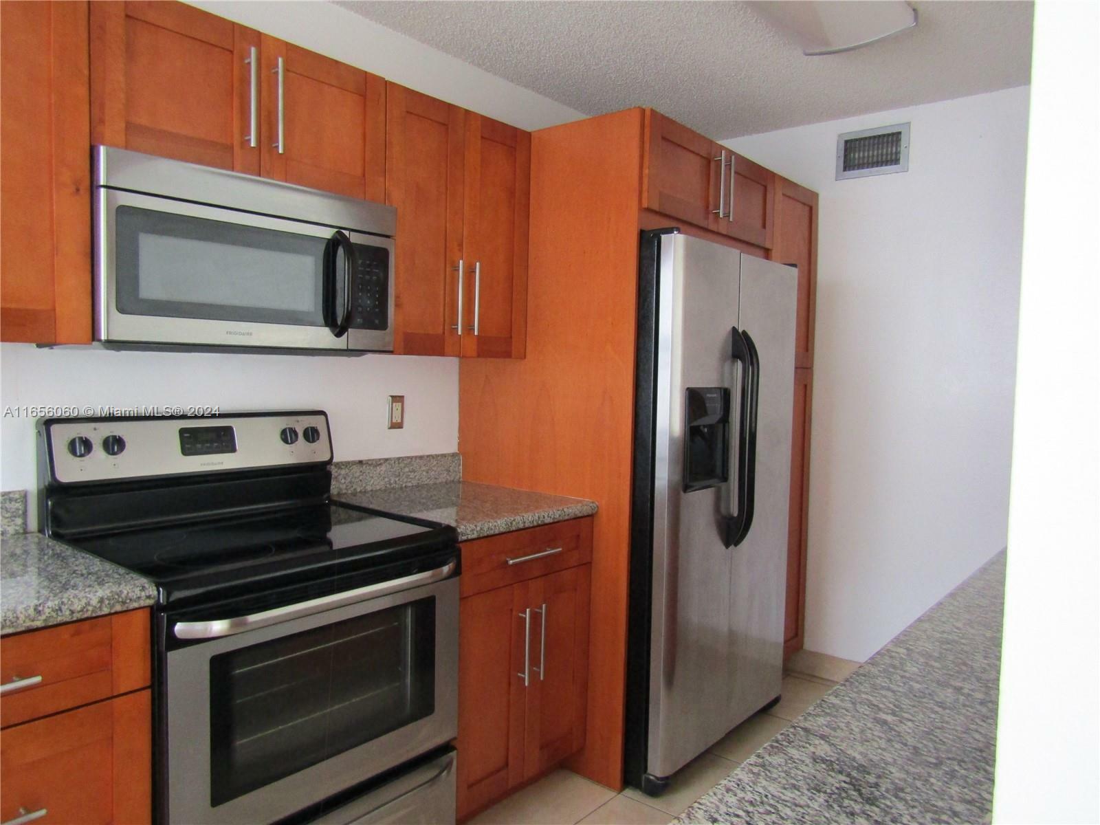 Property Photo:  9783 NW 49th Ter 426  FL 33178 