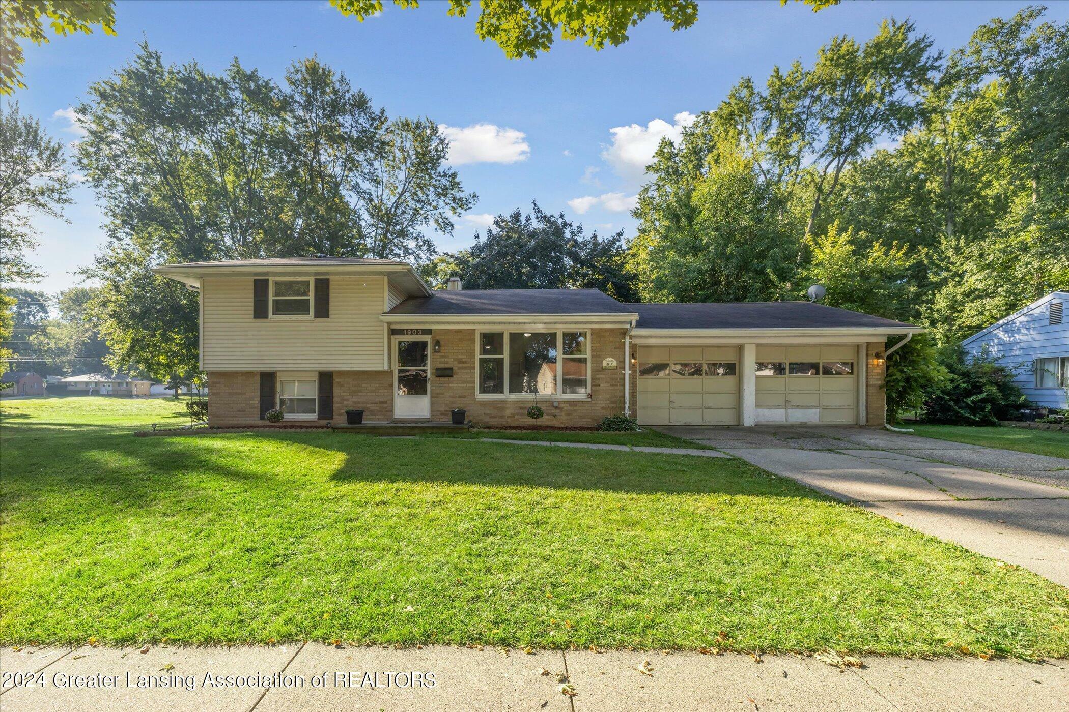 Property Photo:  1903 Peggy Place  MI 48910 