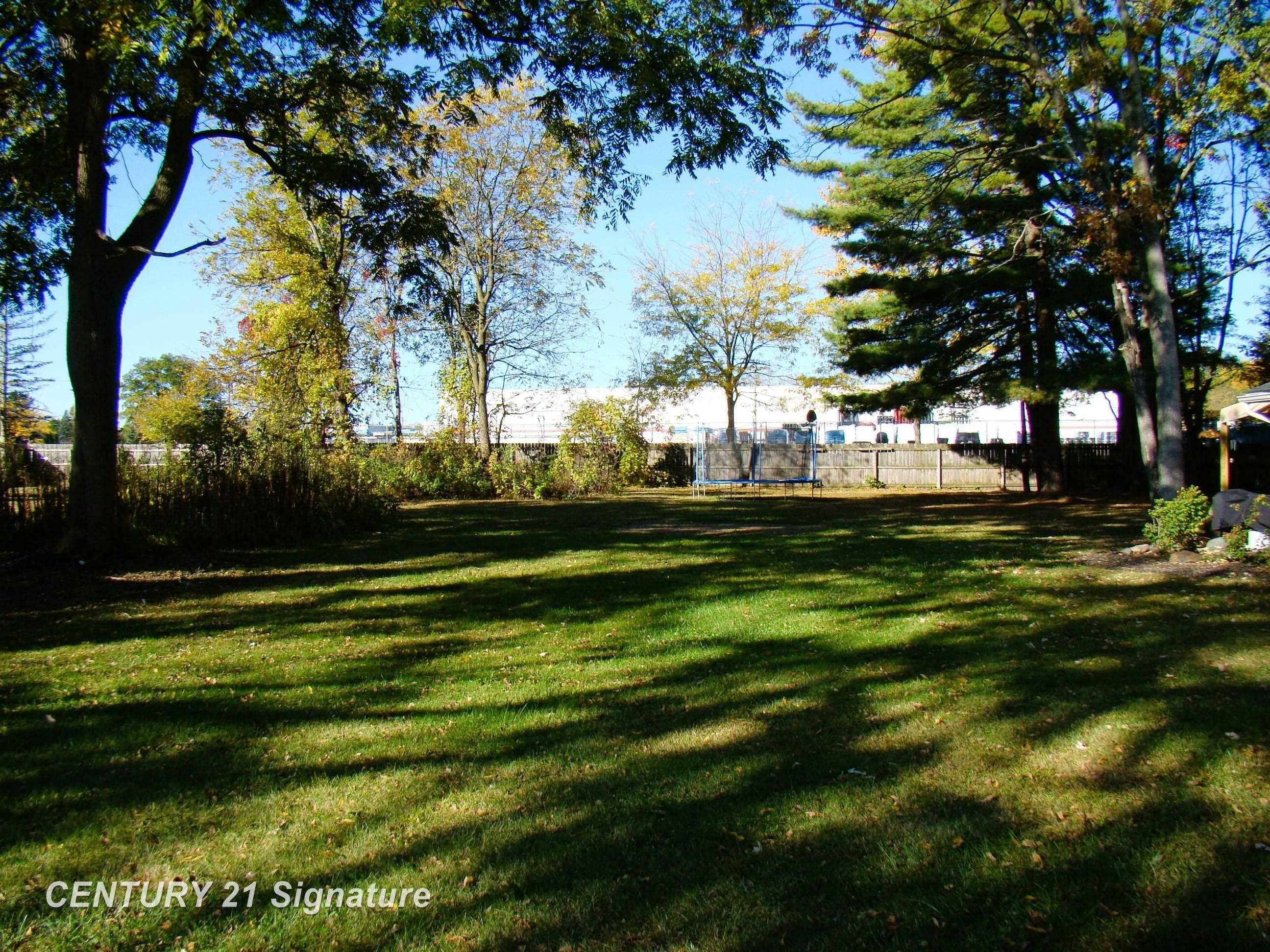 Property Photo:  201 Harrison Drive  MI 48609 