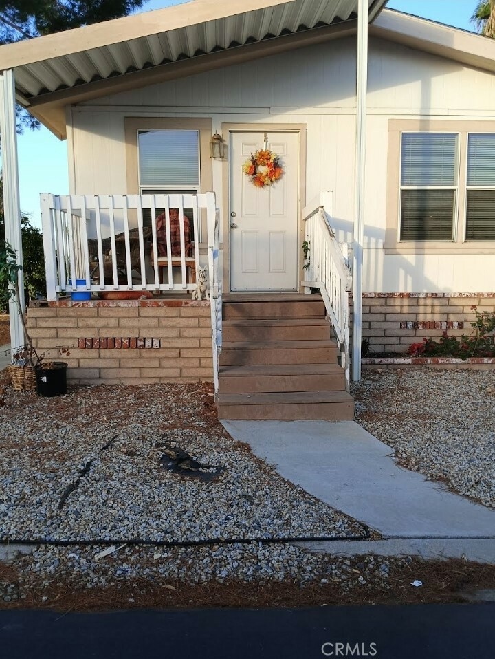 Property Photo:  23820 Ironwood Avenue 84  CA 92557 