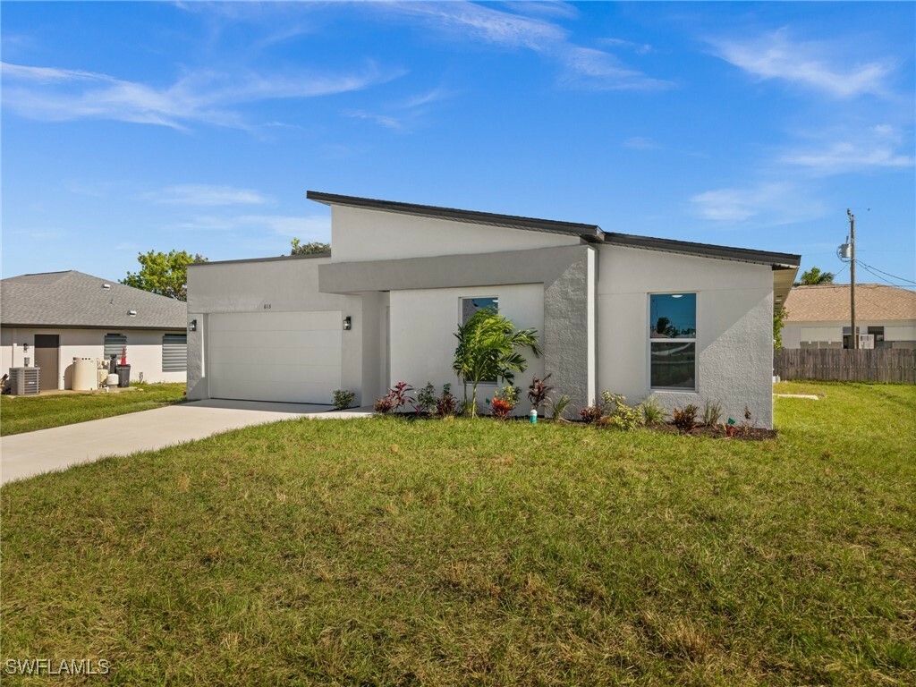 Property Photo:  613 NW 17th Avenue  FL 33993 