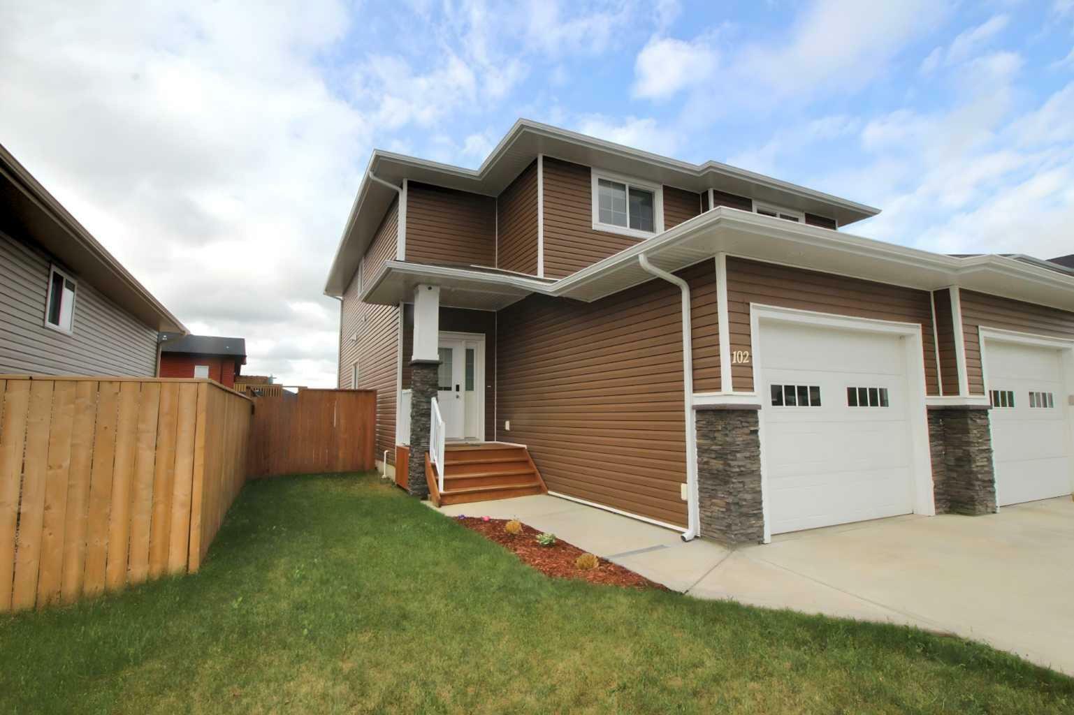 Property Photo: 102 Ranchers Close AB T4L 0H9