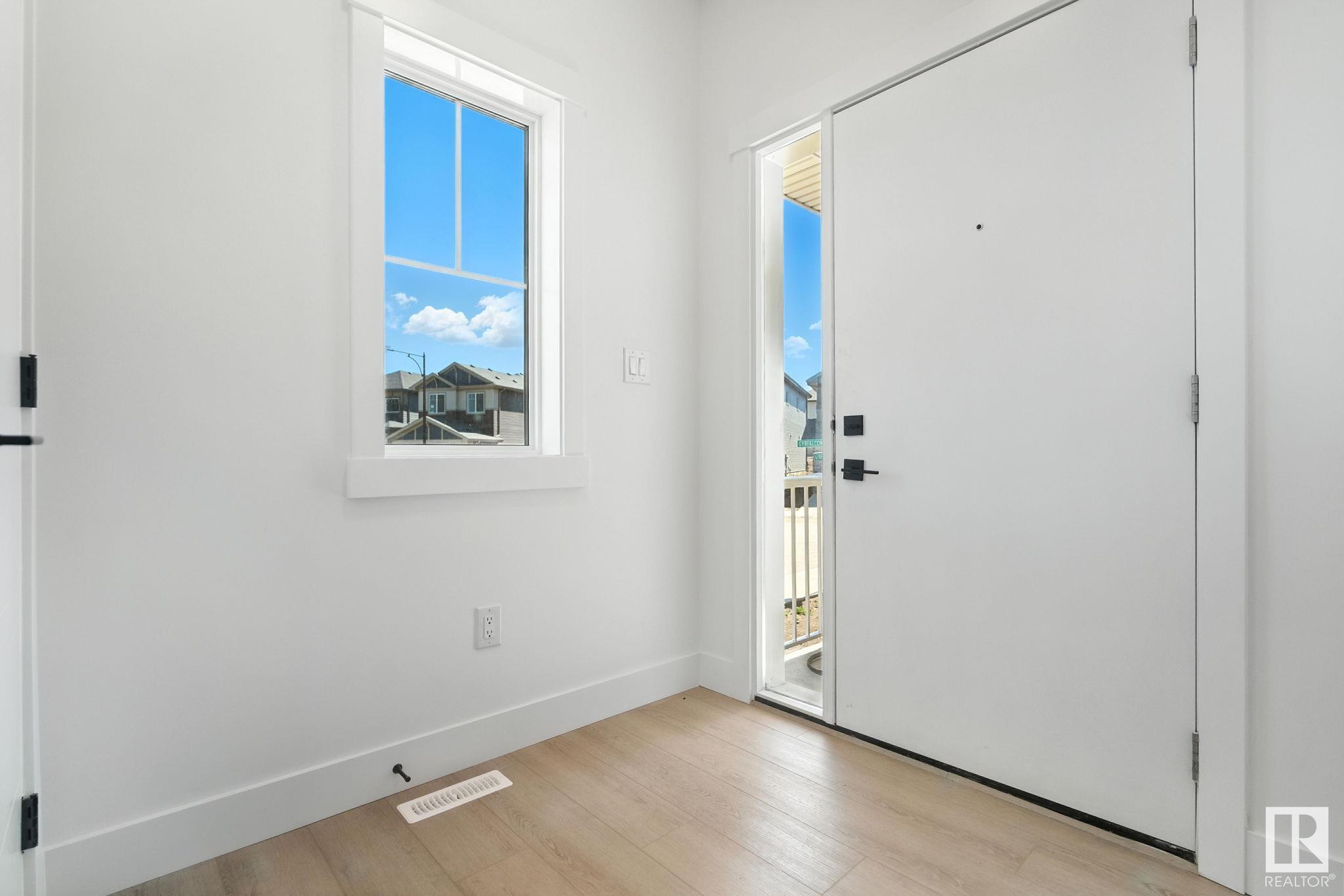 Property Photo:  1135 Gyrfalcon Crescent NW  AB T5S 0S5 