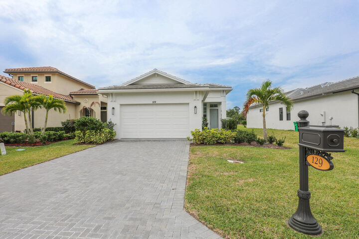 Property Photo: 129 SE Strada Cervaro FL 34952