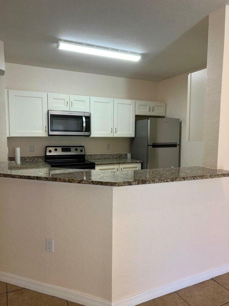 Property Photo: 138 SW Peacock Boulevard 20-102 FL 34986
