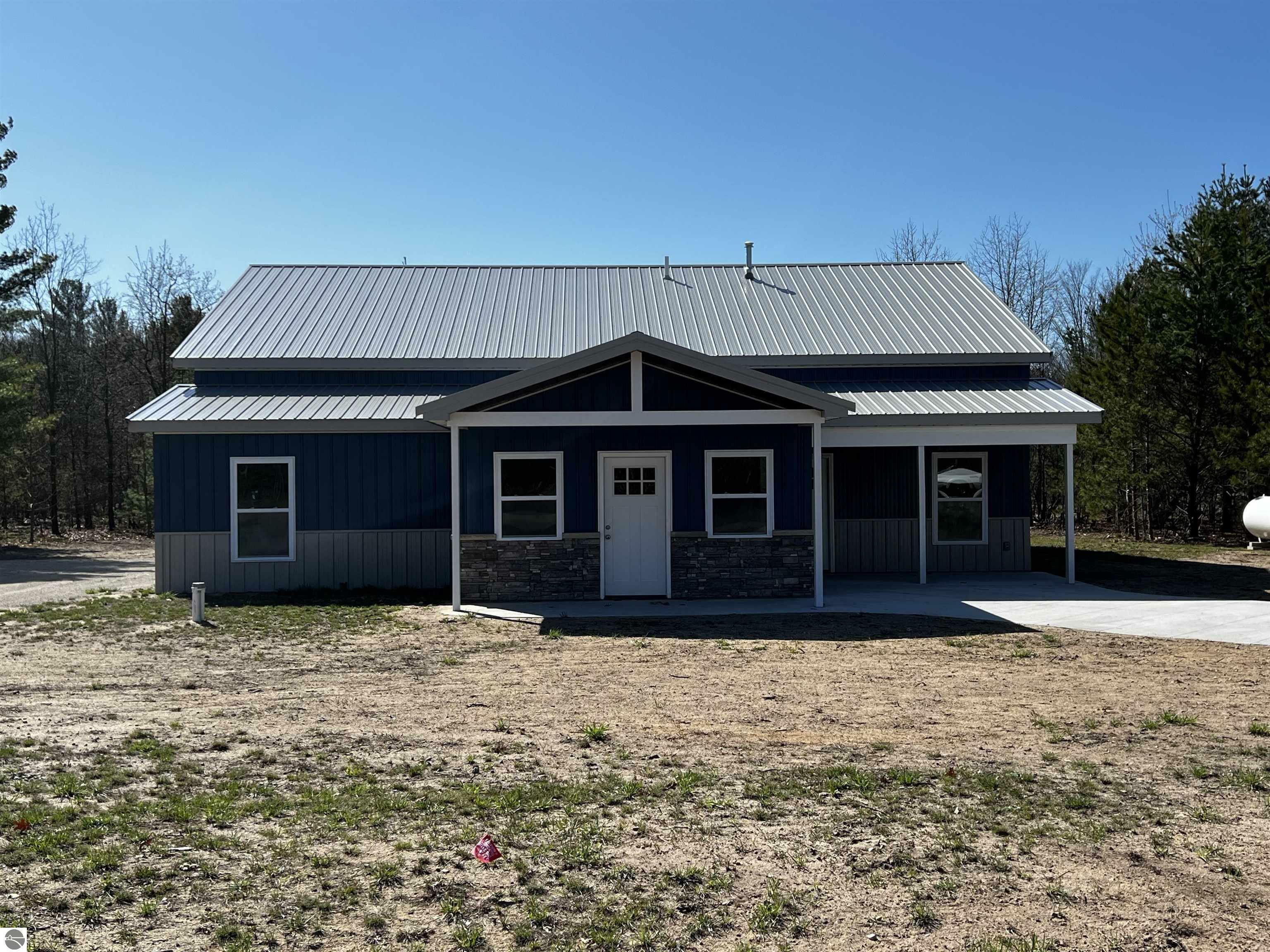 Property Photo: 7918 Springwater Drive Villa De Clearwater MI 49676