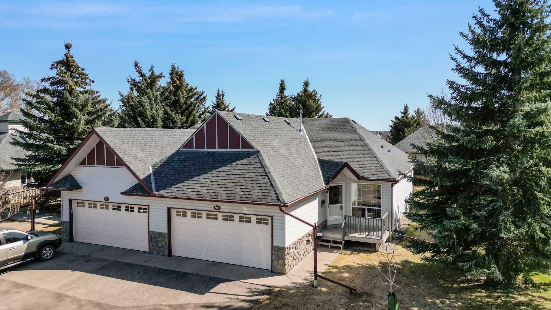Property Photo: 305 Baker Creek Rise SW AB T1V 1V7