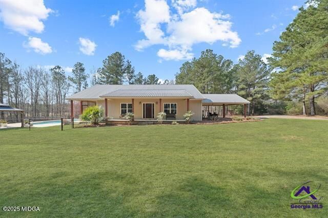 Property Photo:  22299 US-441  GA 31054 