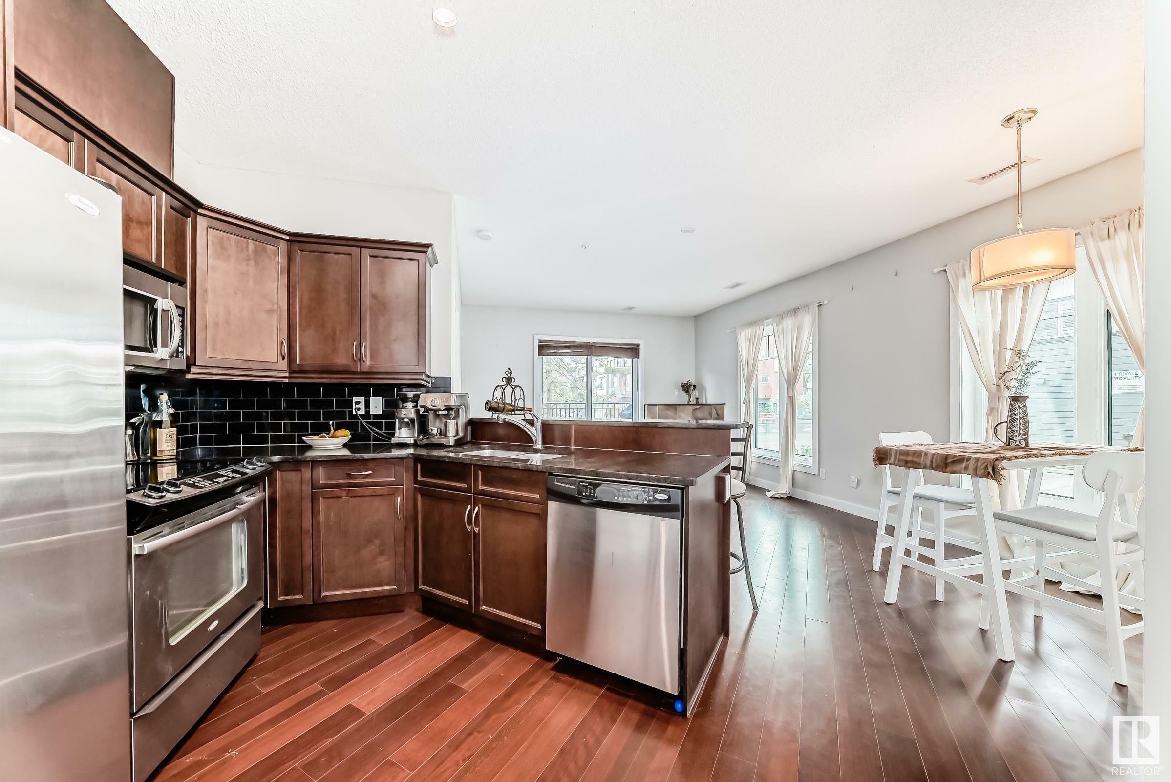 Property Photo: 7907 109 Street NW 102 AB T6G 1C7
