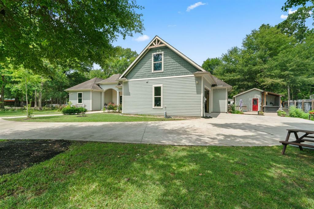 Property Photo: 210 County Road 3311 TX 77327