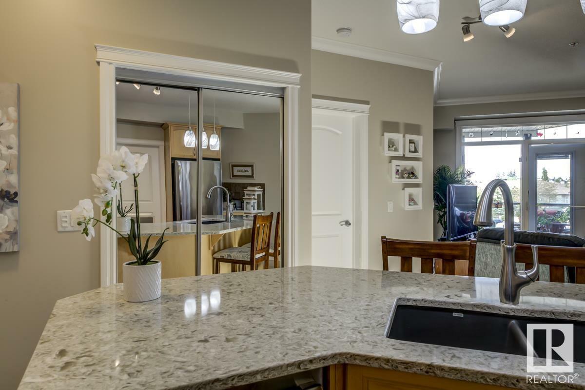 Property Photo: 12408 15 Avenue SW 203 AB T6W 1X2