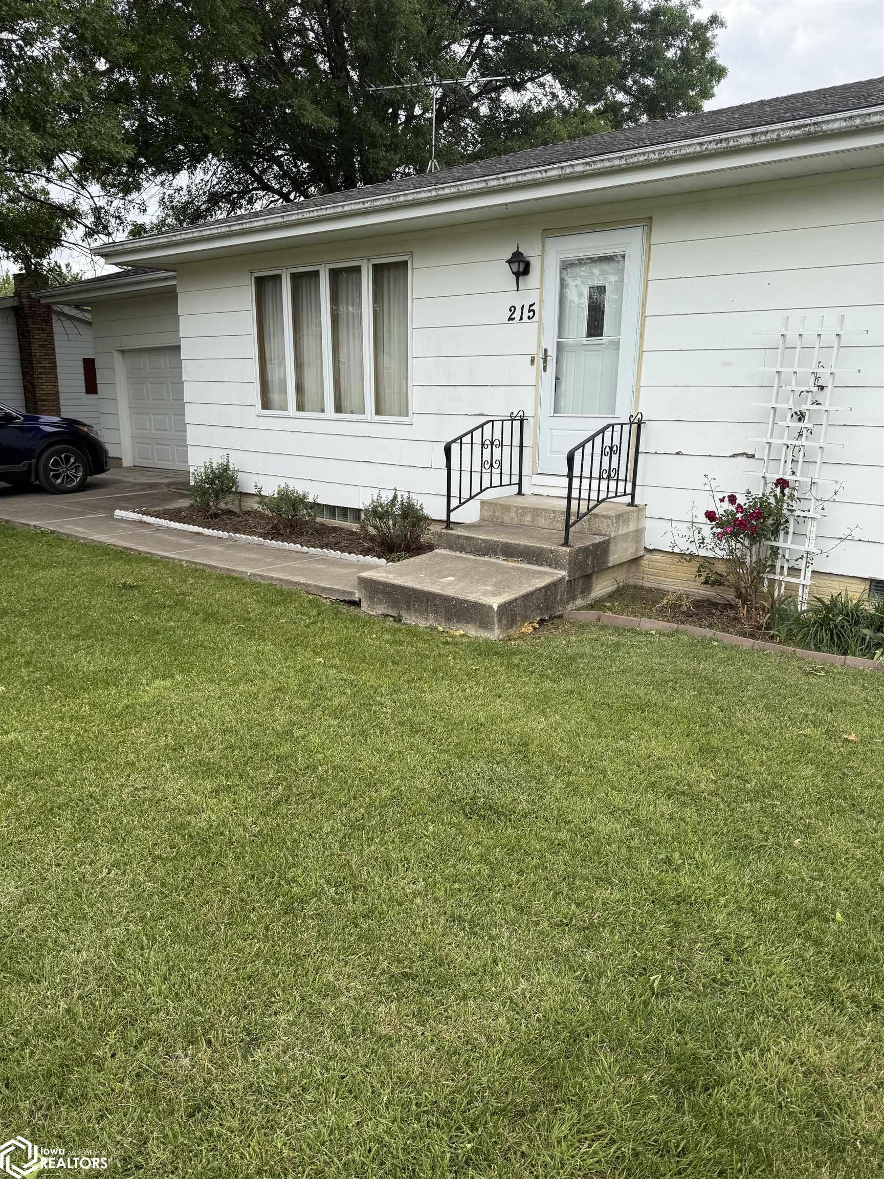 Property Photo:  215 W. Johnston  IA 50635 