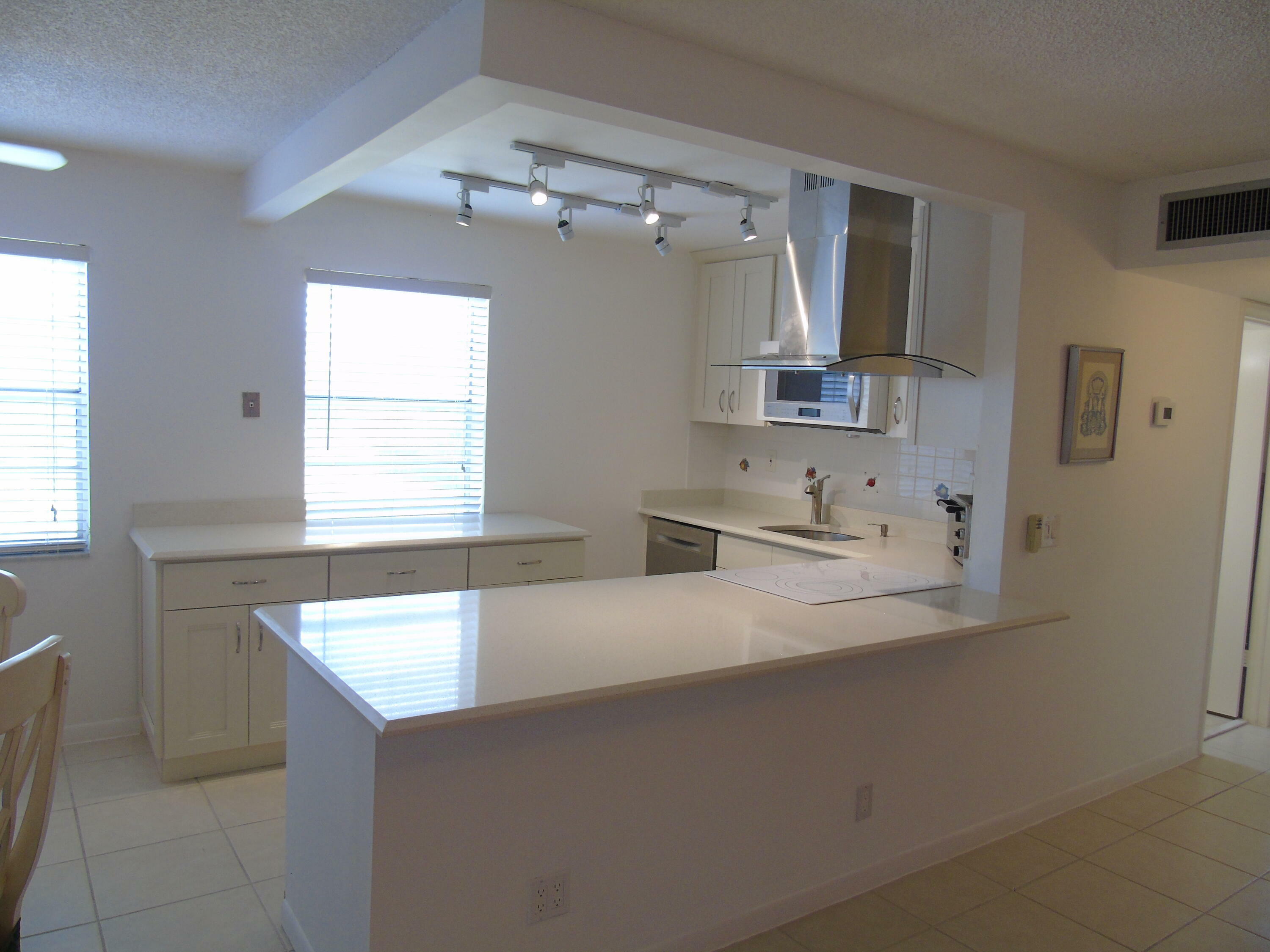 Property Photo:  219 Normandy E  FL 33484 