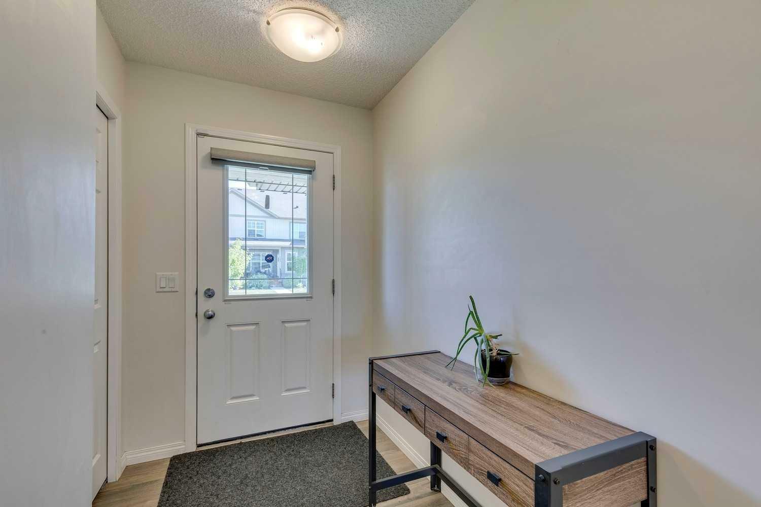 Property Photo: 305 Heartland Crescent AB T4C 2P7