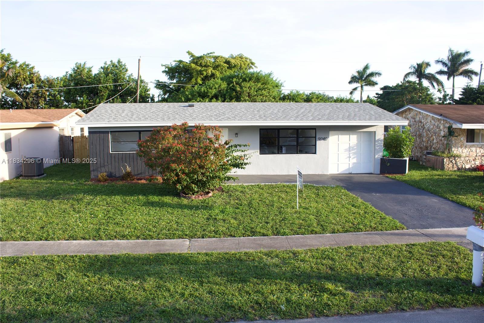 Property Photo: 9040 NW 26th Place Sunrise Golf Village FL 33322