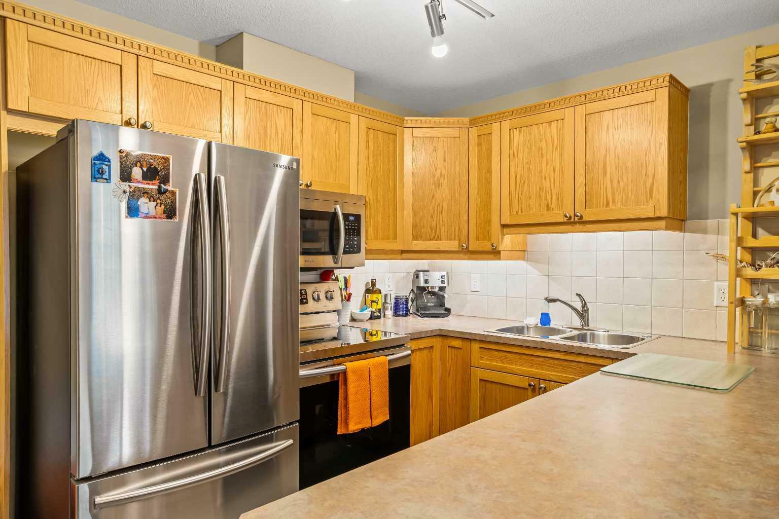 Property Photo: 186 Kananaskis Way NW 408 AB T1W 1R6