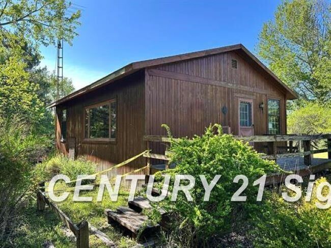 Property Photo:  605 N Poor Farm Road  MI 48740 