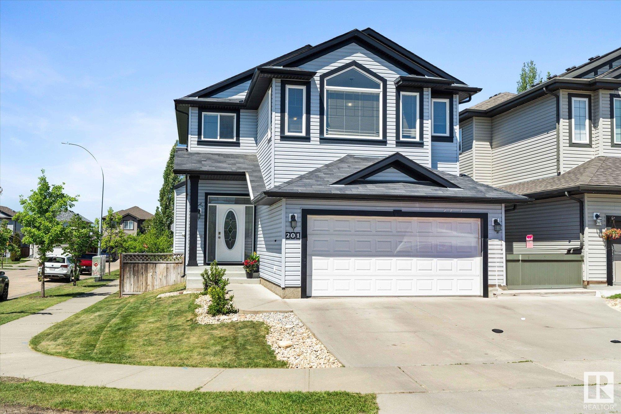 Property Photo: 201 Woodbend Way AB T8L 0B8