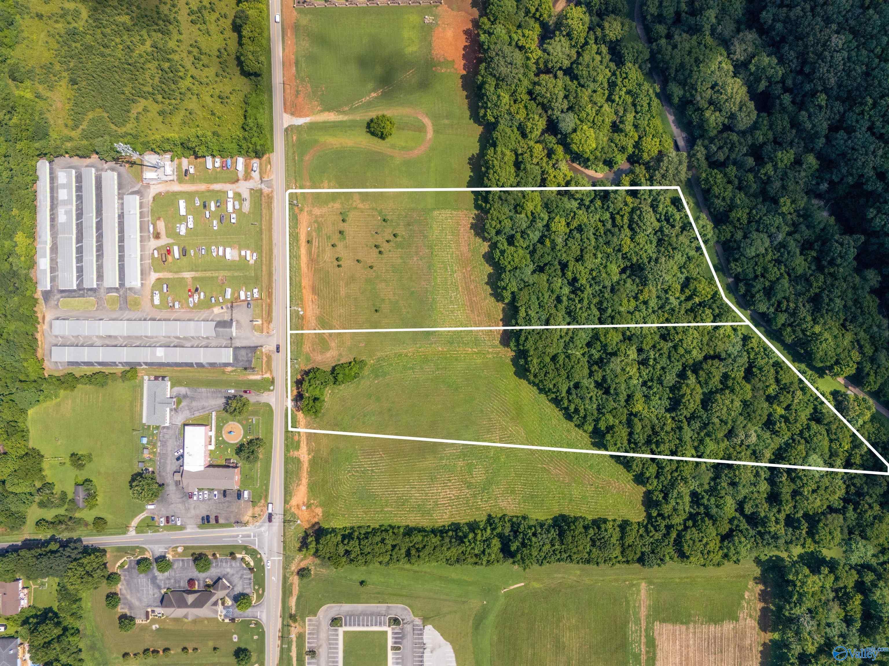 Property Photo:  5.6 Acres A Slaughter Road  AL 35758 