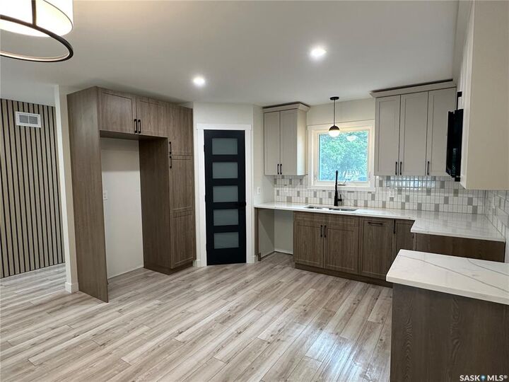 Property Photo:  230 8th Street  SK S4H 1E2 