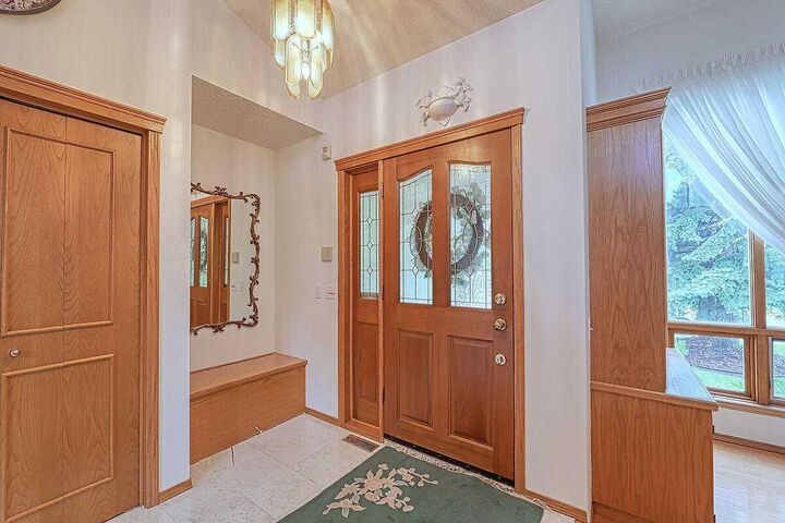 Property Photo:  115 Strathaven Circle SW  AB T3H 2K8 