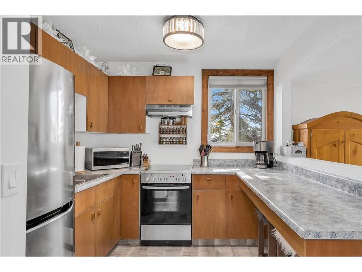 Property Photo: 6375 Whiskey Jack Road 211 BC V1X 4K5