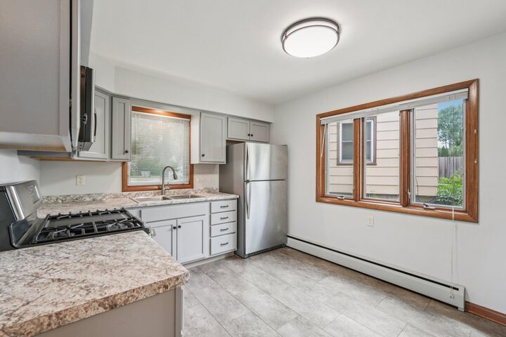 Property Photo:  9707 W Metcalf Pl 9711  WI 53222