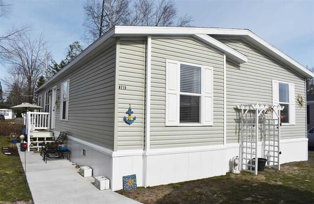 Property Photo:  8715 Sandy Street  MI 49706 