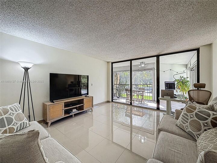 Property Photo:  16475 Golf Club Rd 202  FL 33326 