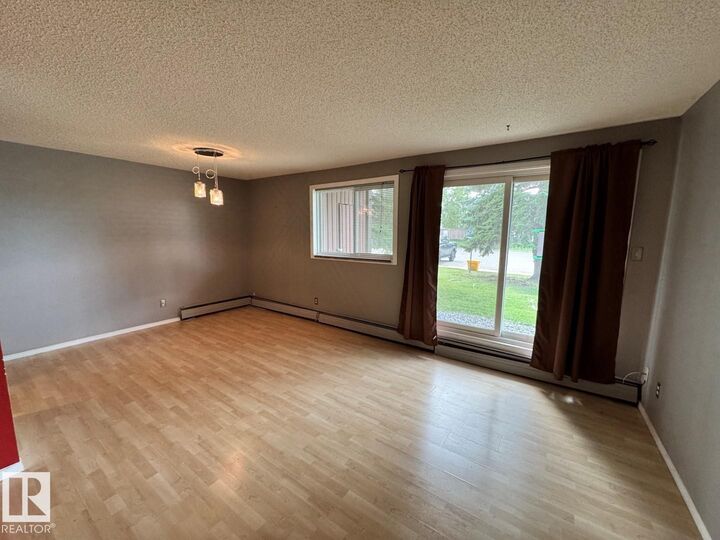 Property Photo: 2303 119 Street NW 101 AB T6J 4E2