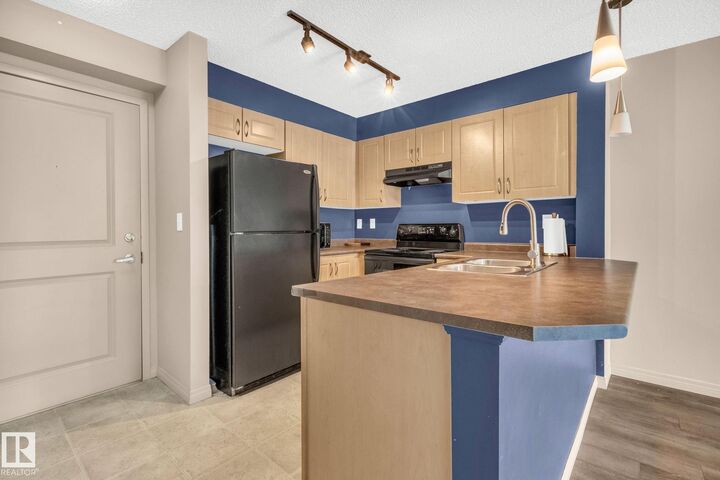 Property Photo: 11441 Ellerslie Road SW 305 AB T6W 1S9