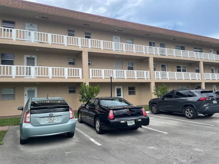 Property Photo: 608 SW Natura Blvd 109 FL 33441