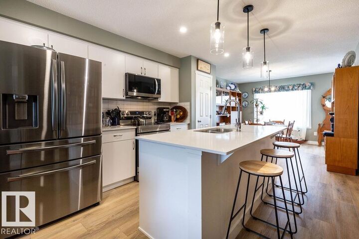Property Photo:  1537 Sandstone Boulevard  AB T8H 1Z8 